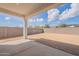 Backyard featuring block wall and dirt; ready for landscaping at 35658 N Lodestone Dr, San Tan Valley, AZ 85144