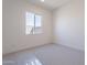 A bright bedroom with a large window offering ample natural light at 35658 N Lodestone Dr, San Tan Valley, AZ 85144