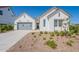 Inviting single-Gathering home boasts desert landscaping and a charming entryway at 35658 N Lodestone Dr, San Tan Valley, AZ 85144