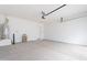 Bright garage with an automatic door, epoxy flooring and water heater at 35658 N Lodestone Dr, San Tan Valley, AZ 85144