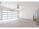 Bright garage with an automatic door, epoxy flooring and water heater at 35658 N Lodestone Dr, San Tan Valley, AZ 85144