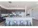 Open concept kitchen featuring a spacious island with seating and ample countertop space at 35658 N Lodestone Dr, San Tan Valley, AZ 85144