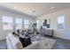 Bright living room offers seating, natural light, and stylish decor and furnishings at 35658 N Lodestone Dr, San Tan Valley, AZ 85144