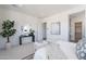 Bright main bedroom with a stylish console table, modern decor, and ample natural light at 35658 N Lodestone Dr, San Tan Valley, AZ 85144