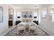 Well-lit main bedroom featuring neutral tones, artwork, and an adjoining bathroom at 35658 N Lodestone Dr, San Tan Valley, AZ 85144