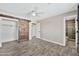 Spacious main bedroom featuring a wood sliding barn door leading to the closet and the tiled ensuite bathroom at 3624 W Citrus Way, Phoenix, AZ 85019