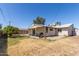 Home exterior with a covered patio, lawn, and an orange tree at 3727 W Gardenia Ave, Phoenix, AZ 85051