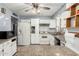 Well-lit kitchen features white cabinets, stone countertops, and stainless-steel appliances at 3727 W Gardenia Ave, Phoenix, AZ 85051
