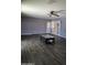Open concept living room with dark hardwood floors, neutral paint, and an updated ceiling fan at 3727 W Gardenia Ave, Phoenix, AZ 85051