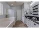 Bathroom with a bathtub, shower and double sink vanity at 42711 N 43Rd Dr, New River, AZ 85087