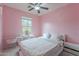 Bright bedroom with a window and white furniture at 42711 N 43Rd Dr, New River, AZ 85087