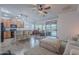 Spacious living area seamlessly connects the kitchen, dining space, and patio, perfect for entertaining and relaxation at 42711 N 43Rd Dr, New River, AZ 85087