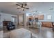 Expansive view showcasing the open living space, seamlessly integrating the kitchen, dining area, and living room at 42711 N 43Rd Dr, New River, AZ 85087