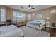 Spacious bedroom with windows and a desk at 42711 N 43Rd Dr, New River, AZ 85087