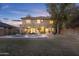 Expansive backyard featuring a swimming pool, covered patio, and ample space for entertaining at 4325 E Vallejo Ct, Gilbert, AZ 85298