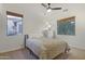 Cozy bedroom with neutral walls, carpet flooring, and windows providing natural light at 4325 E Vallejo Ct, Gilbert, AZ 85298