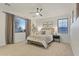 Bedroom with a large window, ceiling fan, and two end tables with lamps at 4325 E Vallejo Ct, Gilbert, AZ 85298