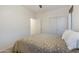 Neutral bedroom featuring a bed, fan, and sliding door closet at 4325 E Vallejo Ct, Gilbert, AZ 85298