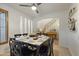 Elegant dining room with decorative shelving, seating for eight, and modern fixtures at 4325 E Vallejo Ct, Gilbert, AZ 85298