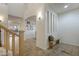 Bright entryway featuring tiled floors, a bench with pillows, and a view into other rooms at 4325 E Vallejo Ct, Gilbert, AZ 85298