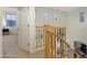 Hallway with wood and iron railings and an open view of the downstairs area at 4325 E Vallejo Ct, Gilbert, AZ 85298