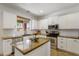 Bright kitchen offers a stainless steel microwave, oven, and dishwasher with granite countertops at 4325 E Vallejo Ct, Gilbert, AZ 85298