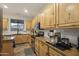 Bright kitchen with light wood cabinets, granite countertops and stainless steel appliances at 4325 E Vallejo Ct, Gilbert, AZ 85298