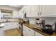 A modern kitchen featuring white cabinets, granite countertops, and stainless steel appliances at 4325 E Vallejo Ct, Gilbert, AZ 85298