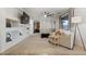 Spacious living room featuring modern furniture, decor, built-in shelving, and a ceiling fan at 4325 E Vallejo Ct, Gilbert, AZ 85298