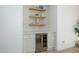 Stylish bar area featuring a wine fridge and floating shelves at 4331 E Avalon Dr, Phoenix, AZ 85018