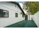 Side yard basketball court with painted brick exterior and updated windows at 4331 E Avalon Dr, Phoenix, AZ 85018