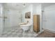 Bright bathroom featuring a soaking tub, glass-enclosed shower, and stylish fixtures at 4331 E Avalon Dr, Phoenix, AZ 85018