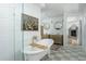 Luxurious bathroom featuring a soaking tub, glass-enclosed shower, and dual vanities at 4331 E Avalon Dr, Phoenix, AZ 85018