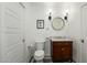Stylish bathroom with white paneling, a dark wood vanity, and black and white tile at 4331 E Avalon Dr, Phoenix, AZ 85018