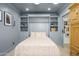 Comfortable bedroom with a murphy bed, built-in shelving, and elegant decor at 4331 E Avalon Dr, Phoenix, AZ 85018