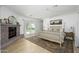 Spacious bedroom with a fireplace, four-poster bed, and doors to the backyard at 4331 E Avalon Dr, Phoenix, AZ 85018