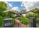 Charming home with a brick walkway, green lawn, and mature landscaping at 4331 E Avalon Dr, Phoenix, AZ 85018