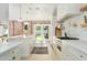 Bright kitchen featuring a marble island, farmhouse sink, and modern appliances at 4331 E Avalon Dr, Phoenix, AZ 85018
