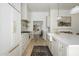 Bright kitchen featuring a marble island, modern appliances, and a brick backsplash at 4331 E Avalon Dr, Phoenix, AZ 85018