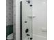 Bright shower featuring white subway tile, black hardware, and a glass shower door at 4331 E Avalon Dr, Phoenix, AZ 85018