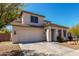 Attractive two-story home with a well-manicured xeriscaped front yard and a two car garage at 4360 S Splendor Ct, Gilbert, AZ 85297