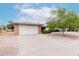 Traditional home with a spacious driveway, two-car garage, and well-maintained landscaping at 5022 E Magic Stone Dr, Phoenix, AZ 85044