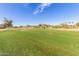 Scenic view of the community golf course accessible from the backyard of the property at 5022 E Magic Stone Dr, Phoenix, AZ 85044