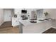 Bright kitchen with granite countertops, stainless steel appliances, and a modern faucet at 5022 E Magic Stone Dr, Phoenix, AZ 85044