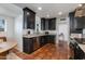 Well-equipped kitchen with sleek cabinetry, granite countertops, stainless steel appliances, and terra cotta tile flooring at 5110 E Verde Ln, Phoenix, AZ 85018