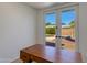 Bright office space with a view of the pool and patio area through double doors at 5110 E Verde Ln, Phoenix, AZ 85018