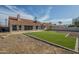 Large backyard with artificial turf and ample space for outdoor entertaining at 5800 W Kesler St, Chandler, AZ 85226