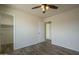 Bedroom features luxury vinyl plank flooring, ceiling fan, and new paint at 5800 W Kesler St, Chandler, AZ 85226