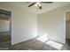 Bedroom featuring luxury vinyl plank flooring, ceiling fan, and new paint at 5800 W Kesler St, Chandler, AZ 85226