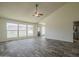 Living room featuring wood-look tile flooring, vaulted ceilings, and lots of natural light at 5800 W Kesler St, Chandler, AZ 85226